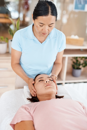Chiropractor, spine and check for woman consulting specialist on posture, assignment and bone therapy. Neck, head and spinal consult by professional physiotherapist for girl with injury or recovery