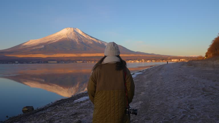 Women tourist stroll Yamanaka lake