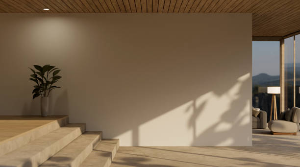 istock Luxury contemporary home corridor interior with stairway, wood plank ceiling, and empty wall. 1468455695