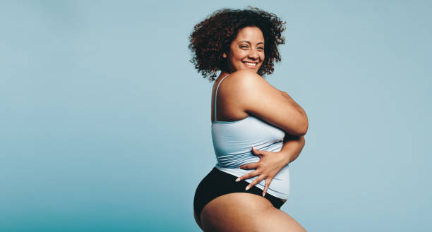 istock Woman proudly embracing her body in a workout studio 1468457344
