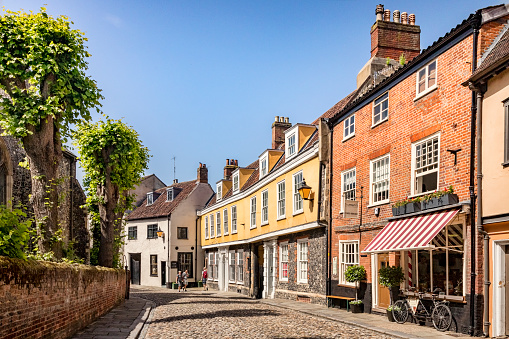 29 June 2019: Norwich, Norfolk - Elm Hill is a historic cobbled street in the centre of Norwich, Norfolk, with many old and interesting buildings, some dating back to the Tudor period.