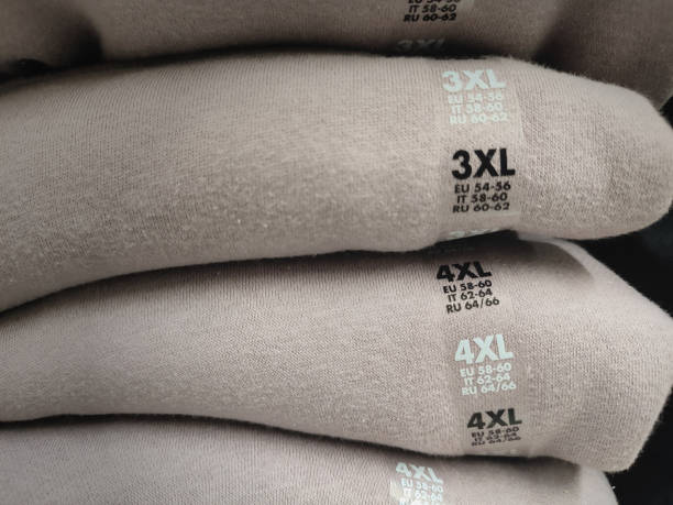 Slightly blurred folded sweater with a size 4 XL tag. Other sizes available