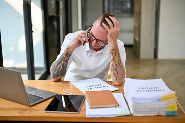 istock Stressed Caucasian businessman on the phone with business client to fix the problems 1468460478