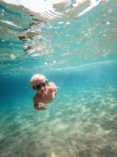 istock Cute Caucasian Kid Looking For Corals Underwater 1468460924