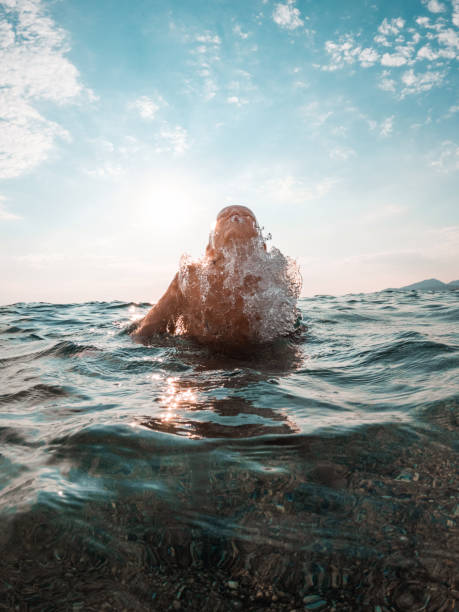 istock Happy Kid Refreshing In The Water On A Hot Summer Day 1468462534