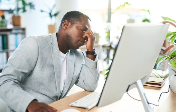 istock Headache, tired black man and stress on computer in business for 404 technology glitch. Frustrated worker, burnout and computer mistake with anxiety, fatigue and depression of problem, crisis or pain 1468462953