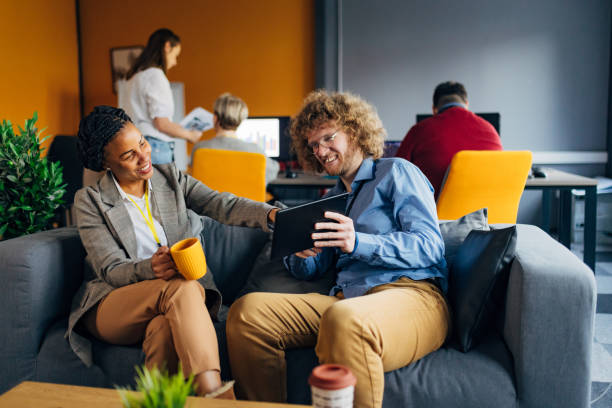 istock A black woman points her finger at something on a digital tablet held by her colleague 1468464986