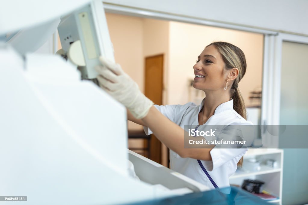 Lab Tech Loading Samples Into A Chemistry Analyzer Female Lab Tech ...