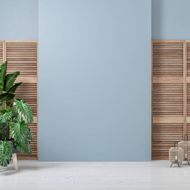 Cozy retro-chic interior with a large blank wall background, slat doors and potted plants, the 50s- 60s decoration stock photo