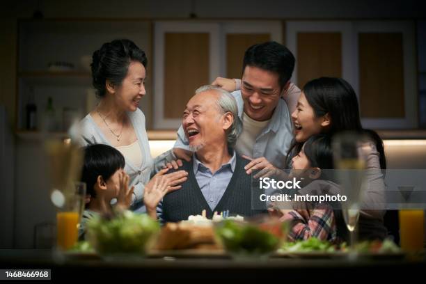 Three Generation Asian Family Celebrating Grandpas Birthday At Home Stock Photo - Download Image Now