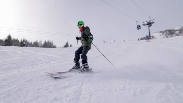 Teenage boy skiing in mountains of European Alps in Austria