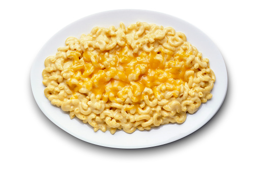 A white plate full of macaroni and cheese isolated on a white background.