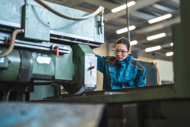 istock Asian Female Factory Worker Operating A Machine 1468471930