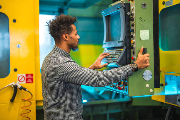 black male cnc machine operator - machine operator imagens e fotografias de stock