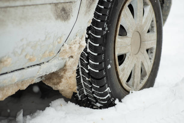 istock Dirty car in snow from the road 1468472125