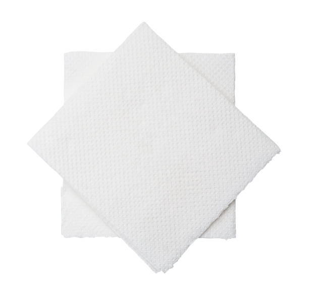 istock Two folded pieces of white tissue paper or napkin in stack isolated on white background with clipping path 1468473343