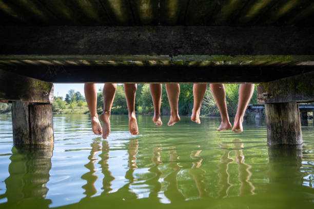 istock Friend sitting on pier 1468473614