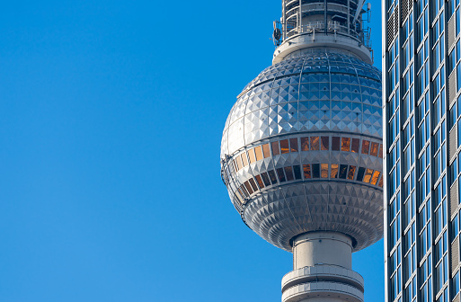 Berlin communications tower agains skyscraper at Berlin Alexanderplatz