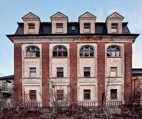 Ruined villa in Germany in dead winter shrubbery.