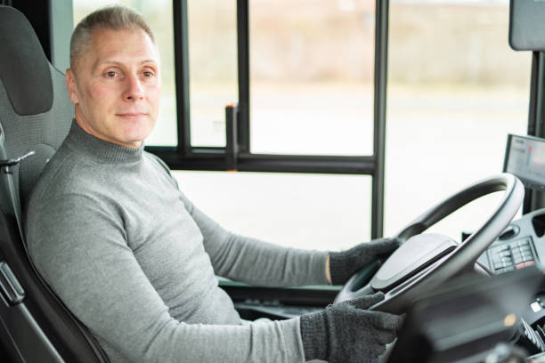 istock Male driver driving a bus 1468478670