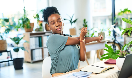 Office stretching, black woman and business employee ready for working and typing. Employee, digital creative writer and desk job of a online content creator with arm stretch feeling relax at work