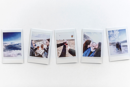 Travel memories concept - Instant photos from a trip on the table. Turkey, Cappadocia