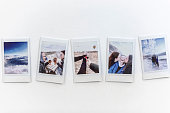 Travel memories concept - Instant photos from a trip on the table