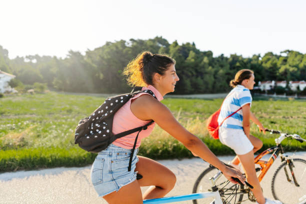 istock High school girls riding bicycles 1468482470