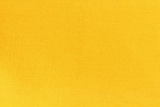 istock Yellow cotton fabric cloth texture for background, natural textile pattern. 1468484315