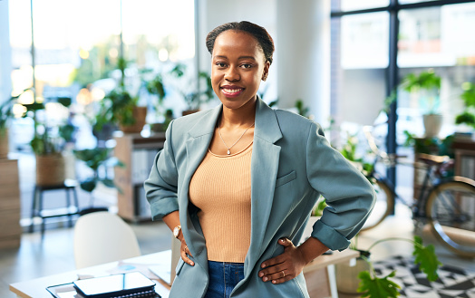 Black woman in business, smile and success, professional mindset and happy with career goals. Corporate vision, boss in workplace and leadership in modern office with growth and pride in work