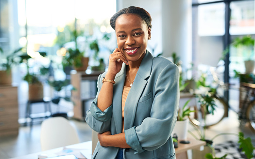 Portrait of black woman in office startup for eco friendly, green mission and sustainable business success. Face of professional employee, boss or manager for leadership, growth strategy and values