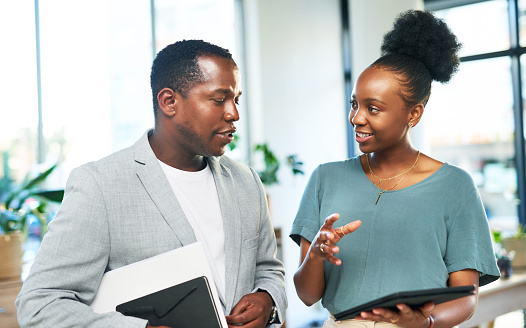 Leadership, tablet or black people planning a digital marketing SEO strategy for a startup or group project. Teamwork, mentorship or manager coaching, talking or speaking of our vision or branding