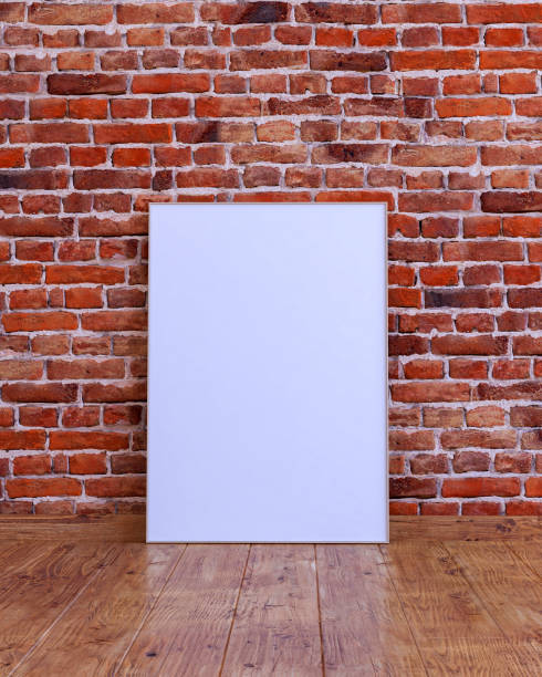 istock Vertical frame mockup on a red brick wall with wooden floor. 1468488924