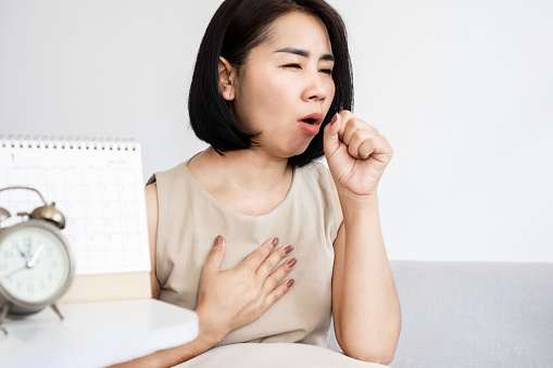 Asian women have problems with chronic cough, woman cough too long and suffering bronchitis