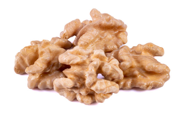 istock Close-up of 4 Walnuts on a White Background 1468495355