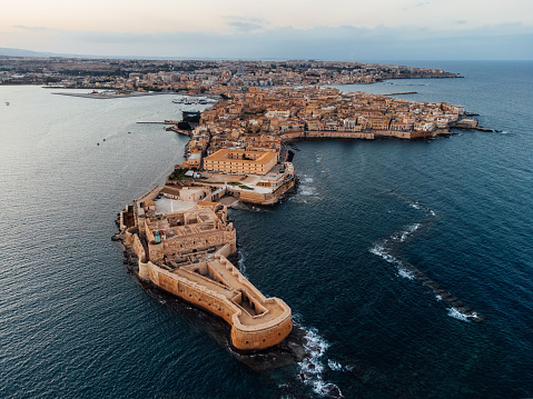 Aerial view of Ortigia Island and Siracusa city at sunset