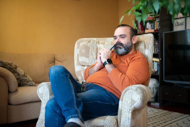 istock A man with a cell phone at home 1468495944