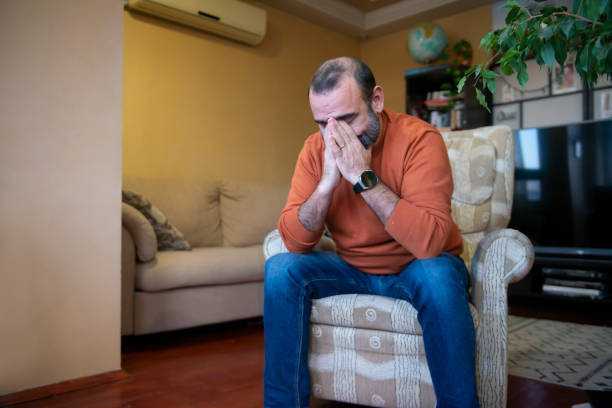 istock A man with a cell phone at home 1468496815