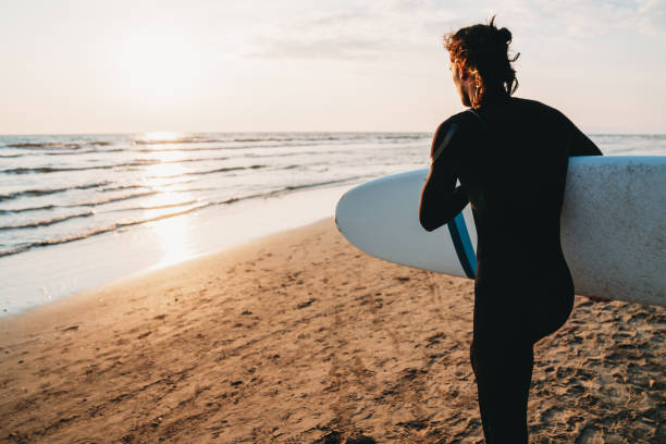 istock A man is running to the sea with his surfboard 1468497183