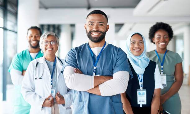 Healthcare, portrait and team of doctors in the hospital standing after a consultation or surgery. Success, confidence and group of professional medical workers in collaboration at a medicare clinic. stock photo