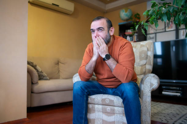 istock A man with a cell phone at home 1468497308