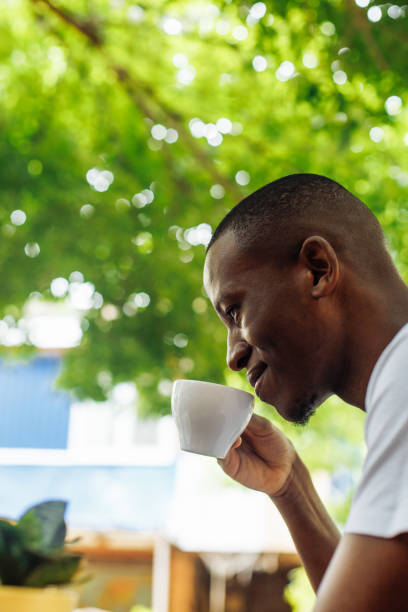 istock Confident and successful multiracial businessman drinking coffee and work, chatting online using laptop in street cafe 1468497368