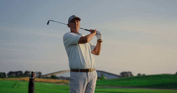 istock Excited golfer playing golf on field. Rich senior practicing sport activity game 1468498011