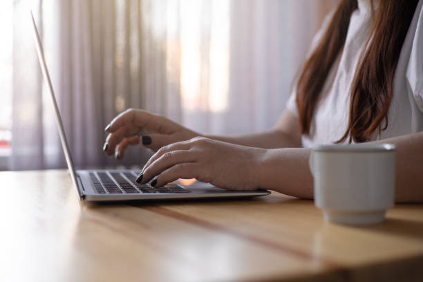 istock Work on the kitchen office. Remote work from home office. Young woman using laptop. Freelancer workplace at kitchen table. Distance education 1468498369