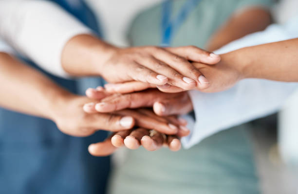 Hands together, business people and team building for company mission, project collaboration and group support. Employees or staff solidarity, hand stack sign and diversity circle for teamwork goals stock photo