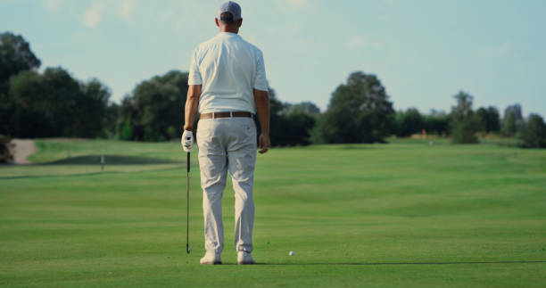istock Man standing golf course alone outdoors. Sport player enjoy fresh air in summer. 1468501702