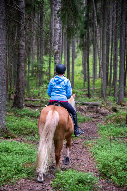 istock Woman horseback riding 1468505174
