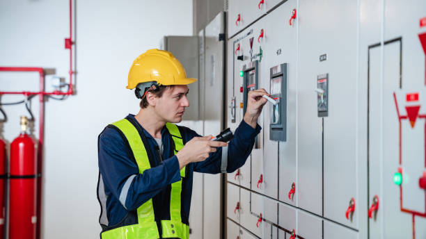 istock The engineers inspected the electrical switchboard and verified the operational voltage range in control room of factory. 1468505223
