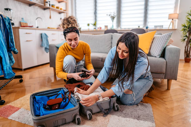 istock Two Female Friends Packing For A Trip 1468506509