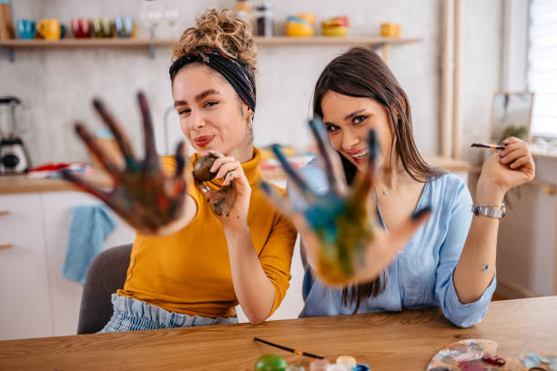 istock Two Young Women With Messy Painted Hands At Easter 1468506901